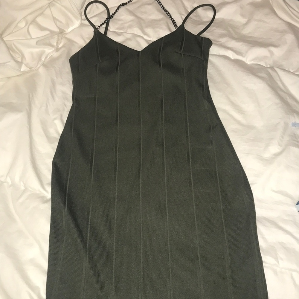 Olive green bodycon dress with a chain